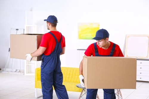Man with a van loading furniture for a move in Catford
