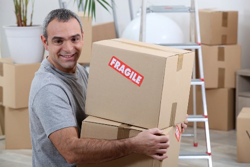 Furniture removals team handling household items in Catford