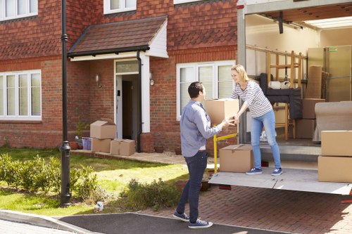 Moving team supporting a home move in Catford with boxes and furniture