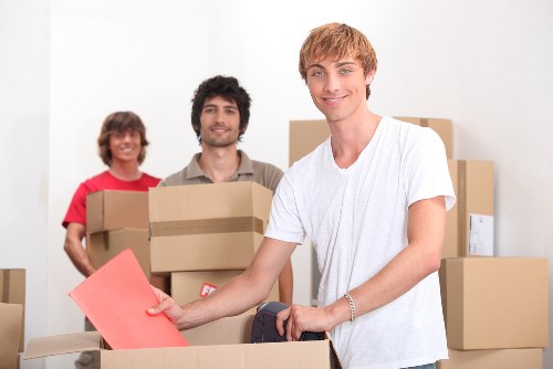 Local office removals team handling equipment in Catford